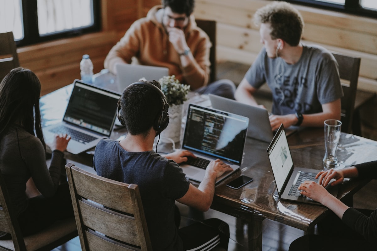 A software team collaborating around a table